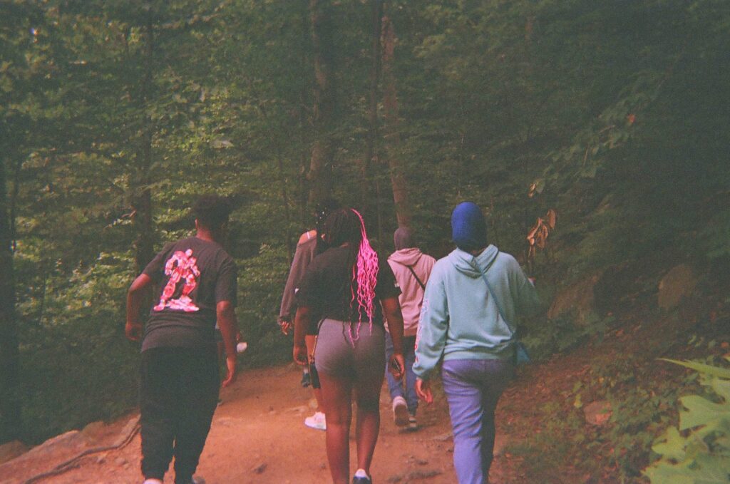 Philly youth walking in the woods as part of the Collective Climb Program